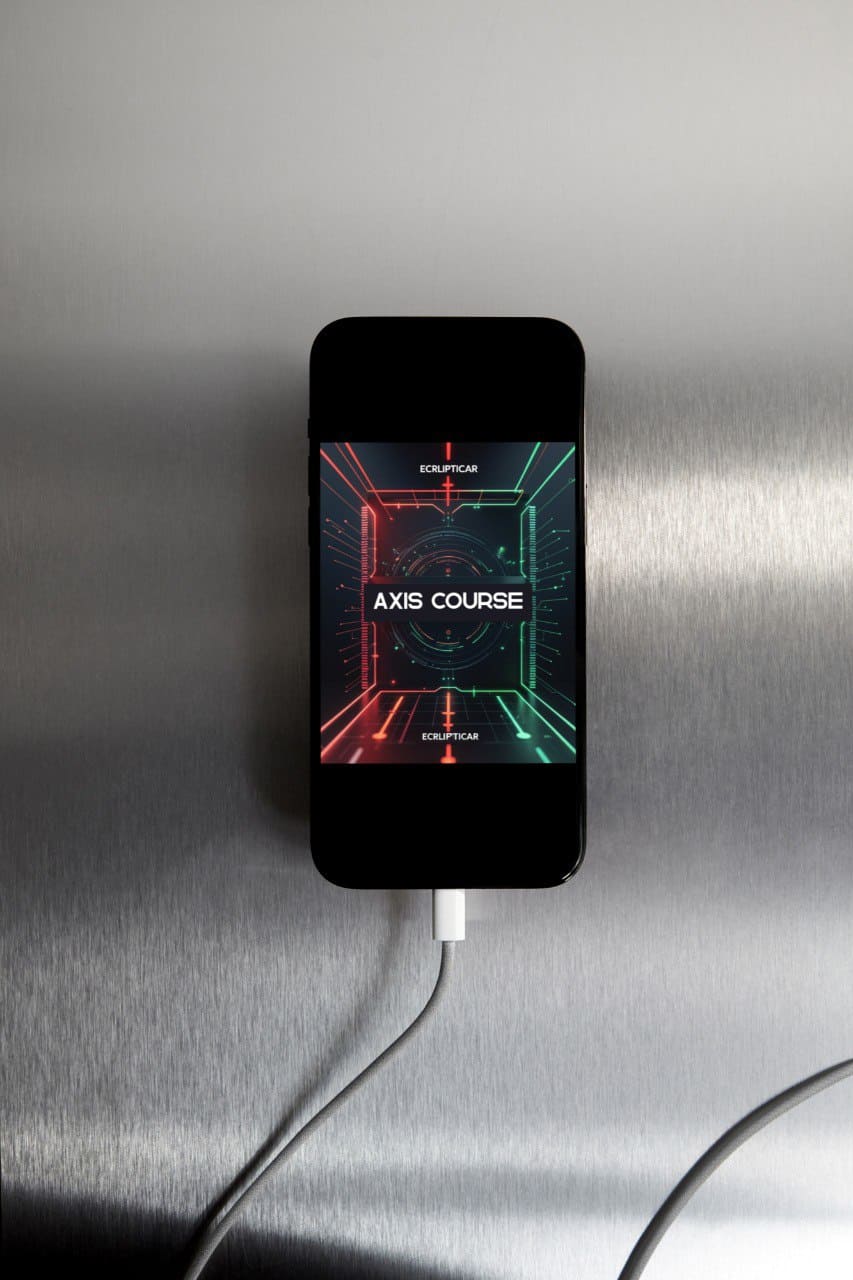 Phone with a 'Axis Course' interface on a metallic surface