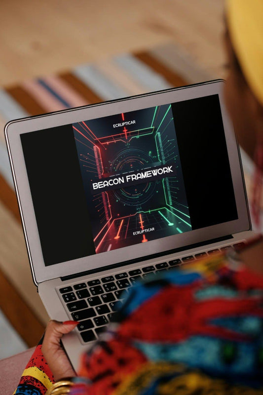 Person holding a laptop with a colorful screen displaying 'Beacon Framework' on a wooden surface.