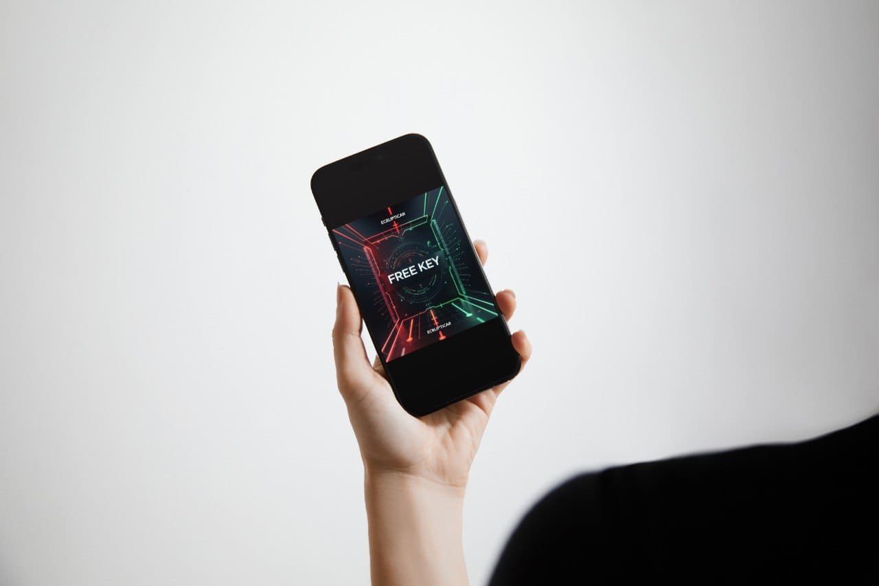 Hand holding a smartphone with a 'Free Key' course on the screen against a white background