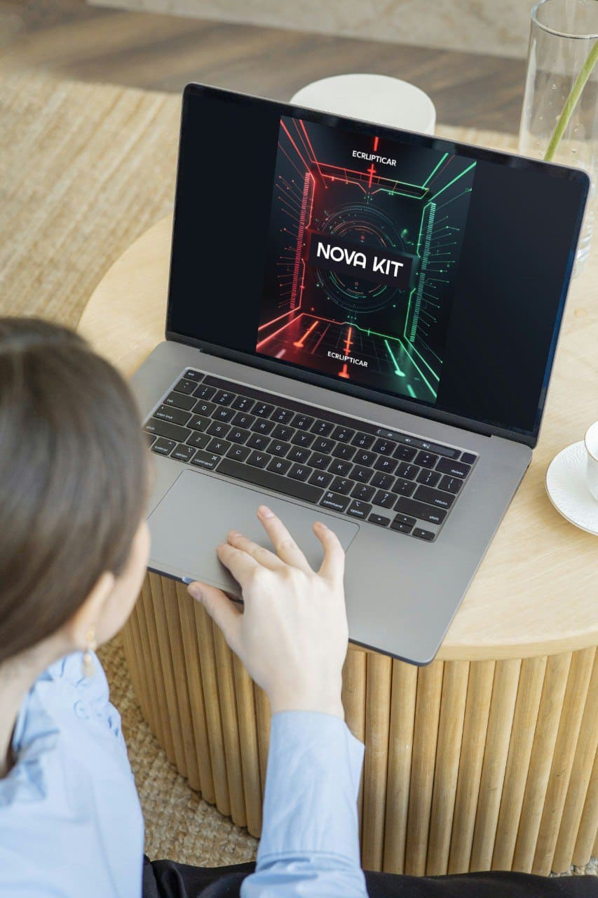 Person using a laptop with 'Nova Kit' course on a wooden table with a visible brand logo.