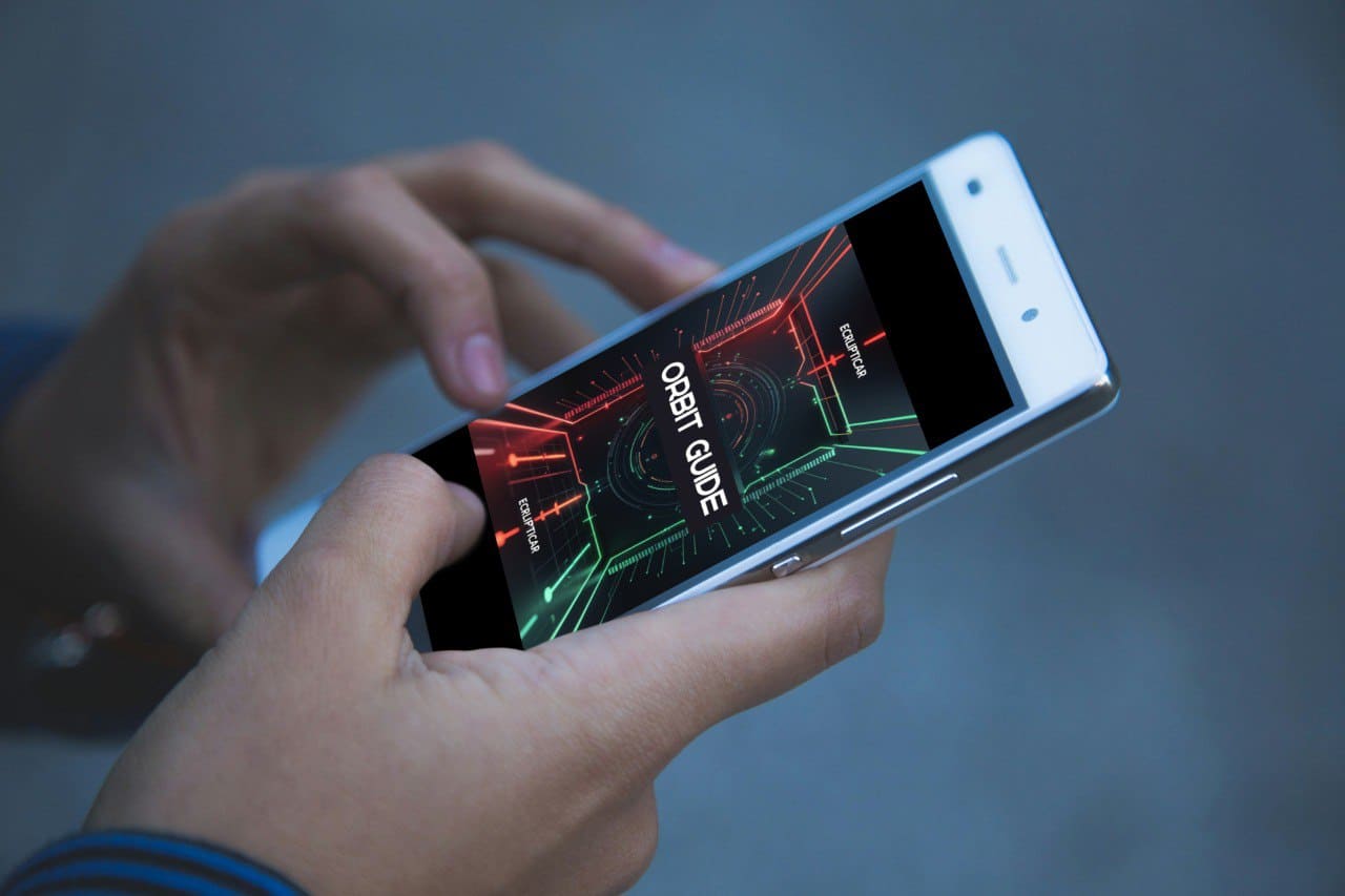 Person holding a smartphone with a 'Orbit Guide' course interface on the screen.